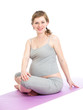 Photo: Pregnant woman doing gymnastic exercises isolated on white Pregnant woman doing gymnastic exercises isolated on white