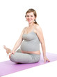 Photo: Pregnant woman doing gymnastic exercises isolated on white Pregnant woman doing gymnastic exercises isolated on white