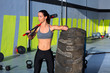 Crossfit sledge hammer woman at gym relaxed