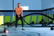 Crossfit battling ropes at gym workout exercise