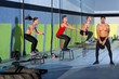 Crossfit box jump people group and kettlebell man