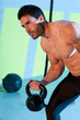 Crossfit man lifting kettlebell workout exercise