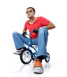 Man on a children's bicycle, on white background