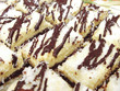 Pieces of coconut cream cake with chocolate