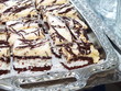Pieces of coconut cream cake with chocolate