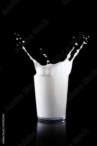 Photo: Splash in a glass with milk Splash in a glass with milk