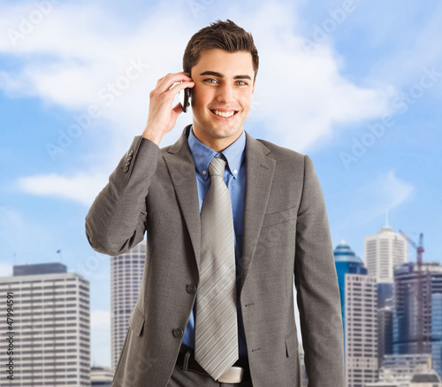 Photo: Businessman talking on the phone Businessman talking on the phone