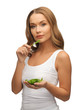 woman with spinach leaves on palms