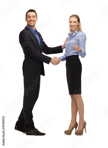 Photo: man and woman shaking their hands man and woman shaking their hands