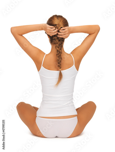 Photo: woman in undrewear practicing yoga lotus pose woman in undrewear practicing yoga lotus pose