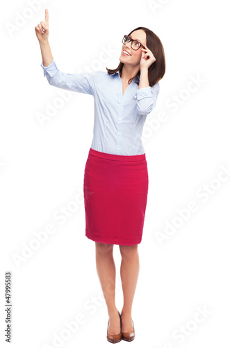 Photo: Business woman pointing up Business woman pointing up