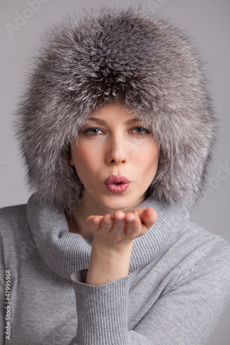 Photo: Beautiful woman in a fur winter hat Beautiful woman in a fur winter hat