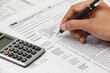 Photo: Person filing 1040 tax form Person filing 1040 tax form
