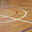 Wooden floor of sports hall with marking lines