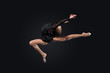 Young woman in gymnast suit posing