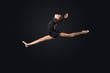 Young woman in gymnast suit posing