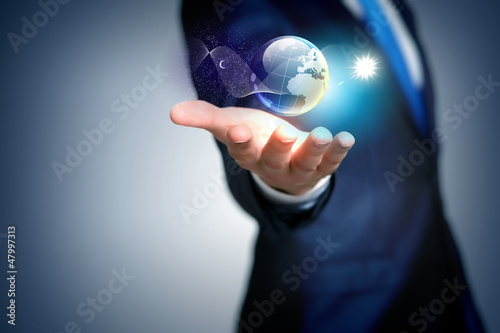 Photo: Human hand holding our planet earth Human hand holding our planet earth