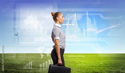 Photo: Business person with digital symbols Business person with digital symbols