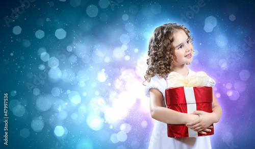 Photo: Happy girl opening gift box Happy girl opening gift box