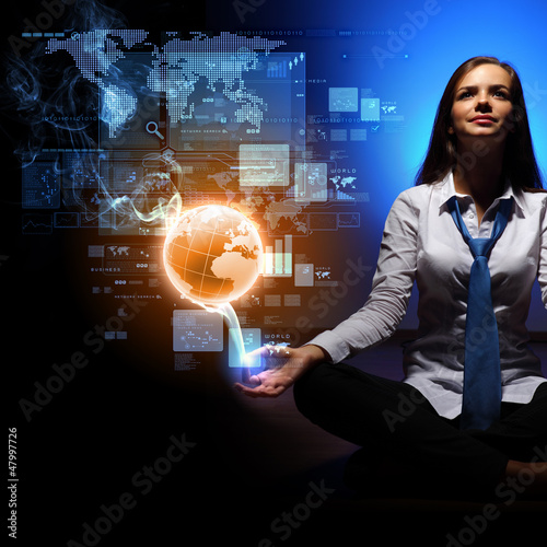 Photo: Business woman with financial symbols around Business woman with financial symbols around