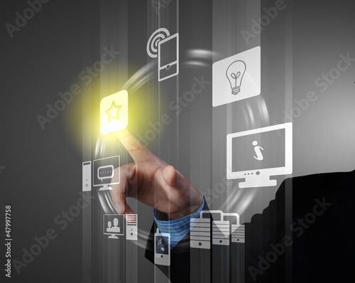 Photo: hand pushing on a touch screen hand pushing on a touch screen