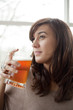 Young Woman Drinking Beer