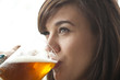 Young Woman Drinking Beer