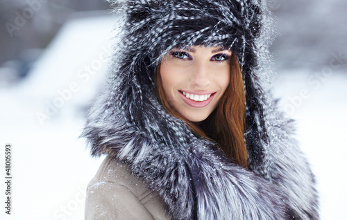 Photo: Young woman winter portrait. Shallow dof. Young woman winter portrait. Shallow dof.