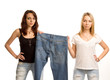 Two sexy friends posing with a pair of jeans