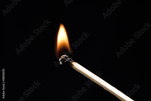 Photo: Un cerillo encendido,fósforo encendido, Un cerillo encendido,fósforo encendido,