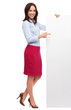 Beautiful woman pointing at blank board