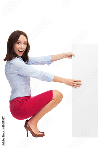 Photo: Businesswoman with blank sign Businesswoman with blank sign