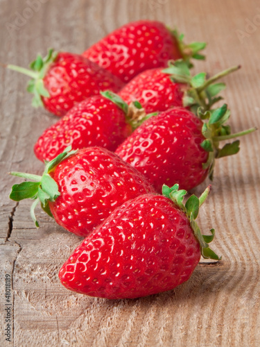 Photo: Fresh strawberries on wooden table Fresh strawberries on wooden table