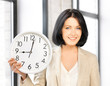 attractive businesswoman with clock