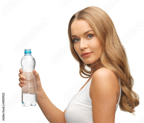 Photo: young beautiful woman with bottle of water young beautiful woman with bottle of water