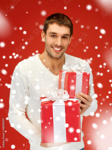 Photo: man holding many gift boxes man holding many gift boxes
