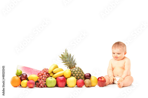 Photo: Baby boy sitting next to various fruits and vegetables Baby boy sitting next to various fruits and vegetables
