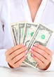 American dollars in a women hands, close up