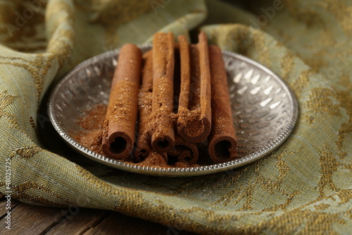 Photo: Cinnamon sticks and powder cinnamon Cinnamon sticks and powder cinnamon