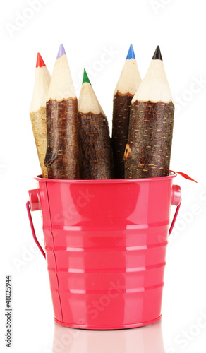 Photo: Colorful wooden pencils in pink purple green pail isolated Colorful wooden pencils in pink purple green pail isolated