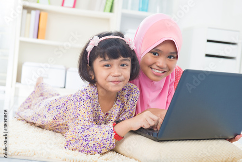 Photo: Southeast Asian children surfing internet Southeast Asian children surfing internet