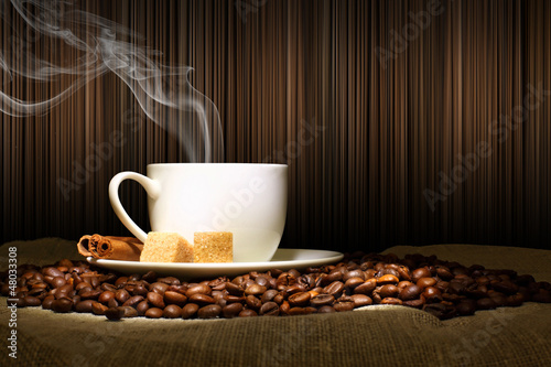 Photo: Coffee beans and white cup Coffee beans and white cup