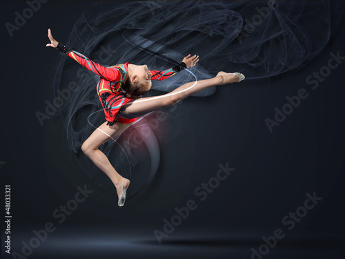 Photo: Young woman in gymnast suit posing Young woman in gymnast suit posing