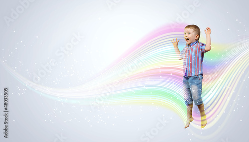Photo: happy kid jumping happy kid jumping