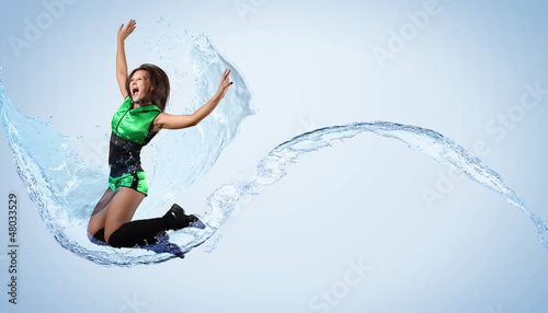 Photo: Young woman dancer. With lights effect. Young woman dancer. With lights effect.