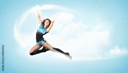 Photo: Young woman dancer. With lights effect. Young woman dancer. With lights effect.