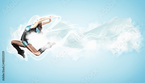 Photo: Young woman dancer. With lights effect. Young woman dancer. With lights effect.