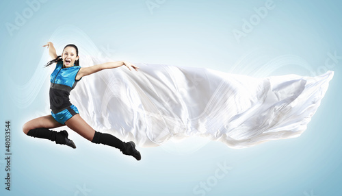 Photo: Young woman dancer. With lights effect. Young woman dancer. With lights effect.
