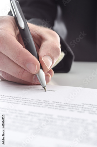 Photo: Businessman signing a contract Businessman signing a contract