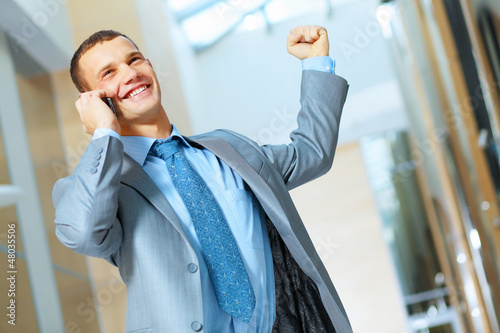 Photo: portrait of happy smiling young businesman portrait of happy smiling young businesman